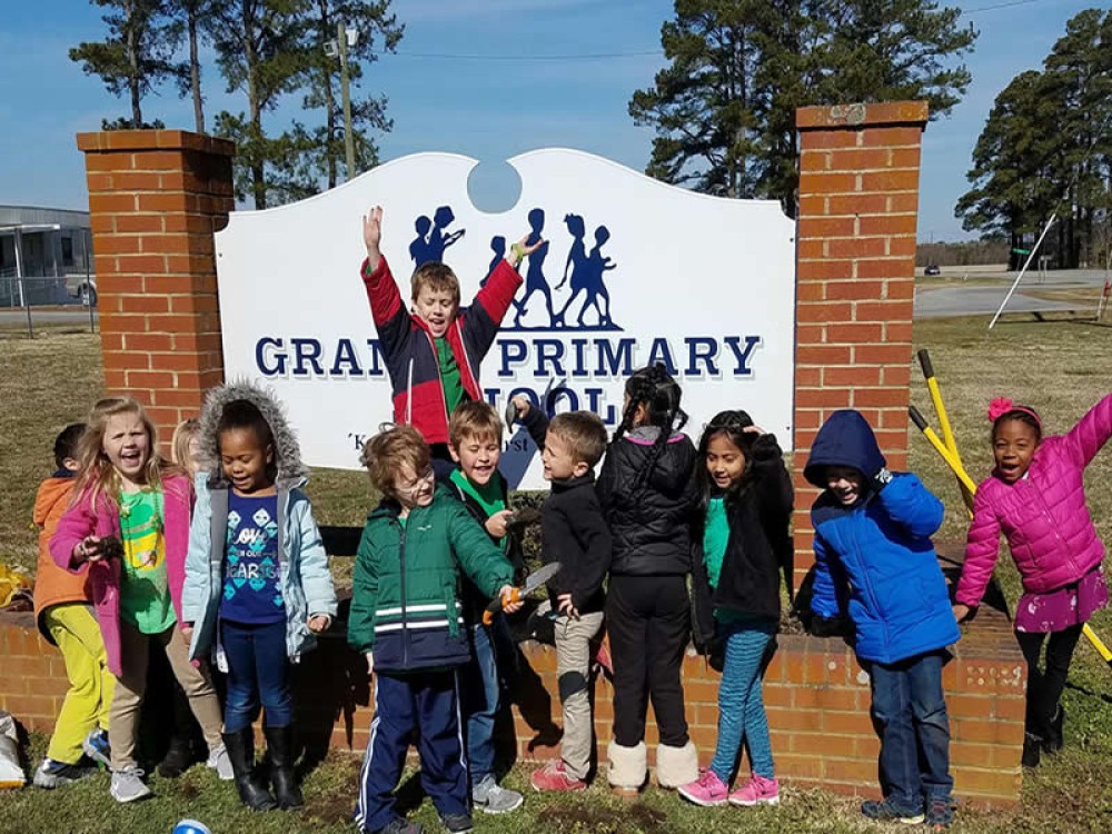 Photo of students in their garden